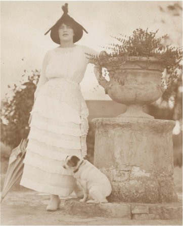 Rose Lindsay in garden at Springwood with Peter the fox terrier
