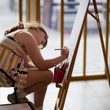 A child drawing at an easel