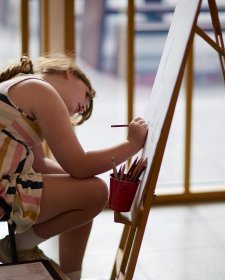 A child drawing at an easel