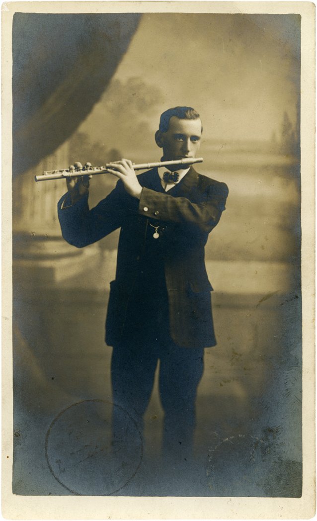 Arthur Kean playing a flute, 1915
