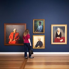 A person viewing artworks in Gallery Five