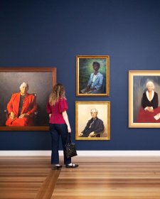 A person viewing artworks in Gallery Five