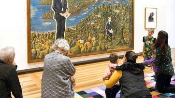 Children and parent in front of the portrait Dr Brown and Green Old Time Waltz