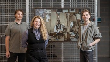 Art Handlers standing with their selected winning photograph