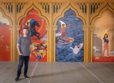 Ryan Presley in front of his artwork Paradise won