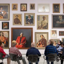 People viewing portraits in Gallery One