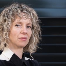 Bree Pickering standing in front of a colourful wall