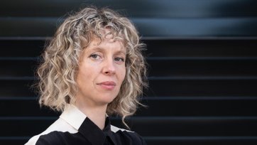 Bree Pickering standing in front of a colourful wall