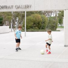 Children with a soccer ball in front of the National Portrait Gallery