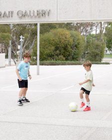 Children with a soccer ball in front of the National Portrait Gallery