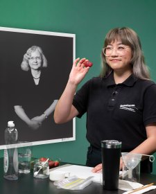 A Questacon presenter holds a strawberry