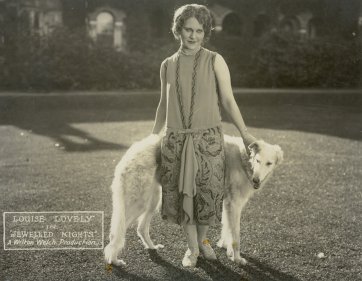 Jewelled Nights: Louise Lovely poses with a large dog