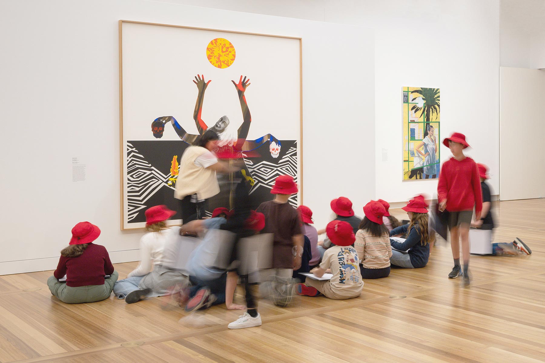 Children sitting in front of an artwork in Gallery Two