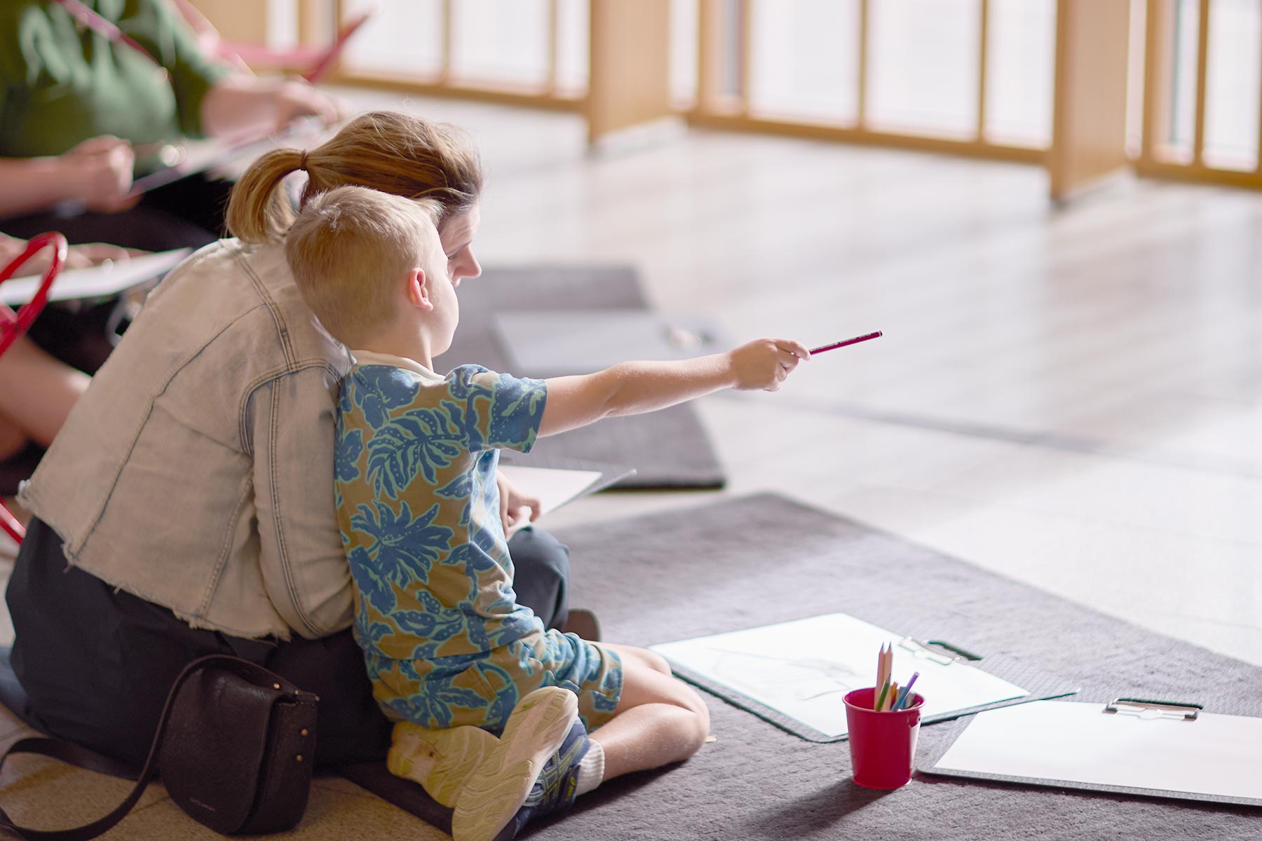 A mother and child drawing in Gordon Darling Hall
