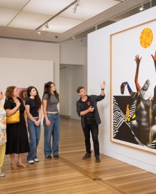 People looking at an artwork in the Gallery