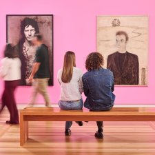 People sitting in front of artworks in Gallery Four