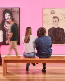 People sitting in front of artworks in Gallery Four
