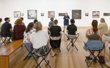 People listening to a talk in Gallery Five