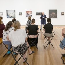 People listening to a talk in Gallery Five