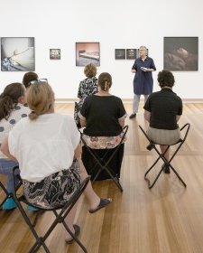 People listening to a talk in Gallery Five