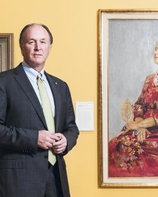 Sid Myer AM in front of Helena Rubinstein in a red brocade Balenciaga gown 1957 by Graham Sutherland. Purchased with funds provided by Marilyn Darling AC, Tim Fairfax AC and the Sid and Fiona Myer Family Foundation 2015.