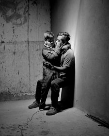 Carlos Soyos, 34, a migrant from Guatemala City, Guatemala and his son, Enderson Soyos, 8, take a self portrait at El Buen Samaritano migrants shelter, Juarez, Chihuahua, Mexico, 2021 Adam Ferguson