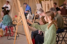 People drawing at easels in the Gordon Darling Hall