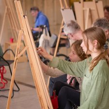 People drawing at easels in the Gordon Darling Hall